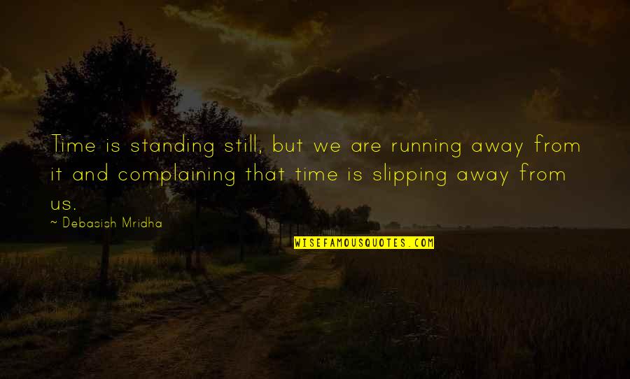 Standing Still Quotes By Debasish Mridha: Time is standing still, but we are running