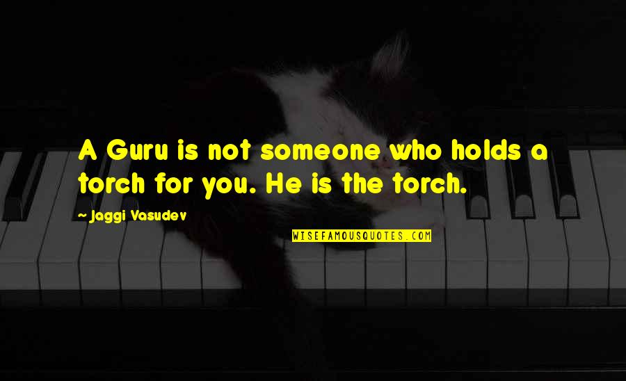 The Guru Quotes By Jaggi Vasudev: A Guru is not someone who holds a