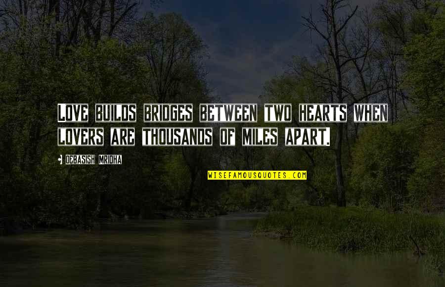 The Miles Between Quotes By Debasish Mridha: Love builds bridges between two hearts when lovers