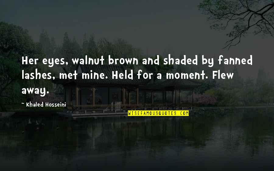 The Moment We Met Quotes By Khaled Hosseini: Her eyes, walnut brown and shaded by fanned