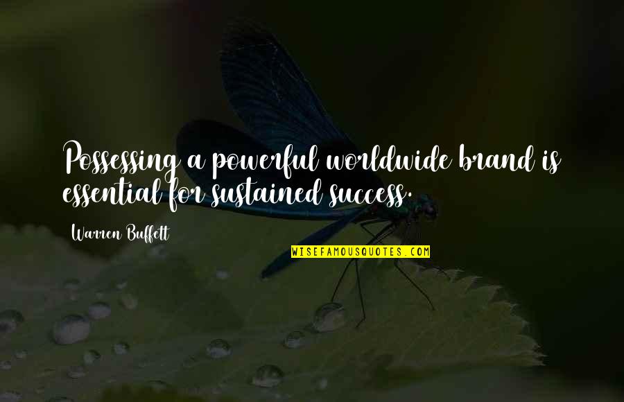 Thymotic Quotes By Warren Buffett: Possessing a powerful worldwide brand is essential for