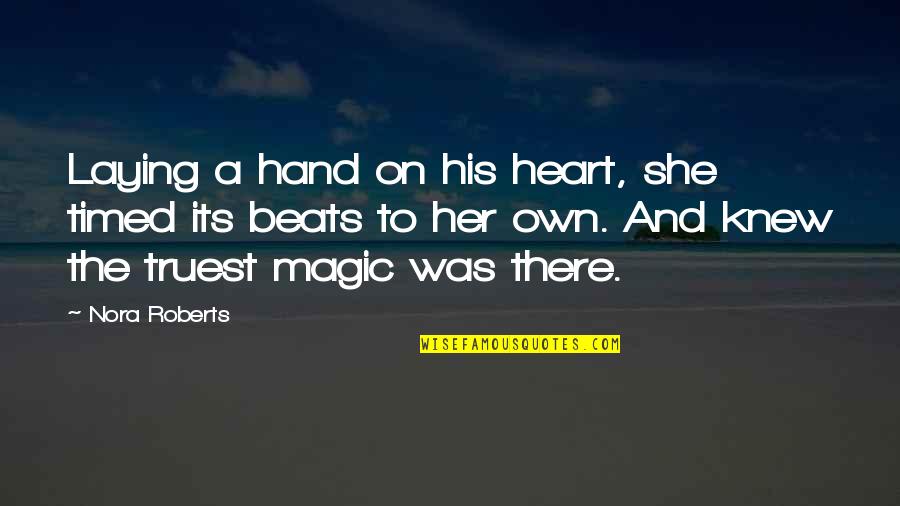 Timed Quotes By Nora Roberts: Laying a hand on his heart, she timed