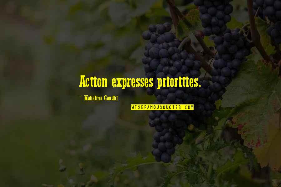 Travesseiro Triangular Quotes By Mahatma Gandhi: Action expresses priorities.