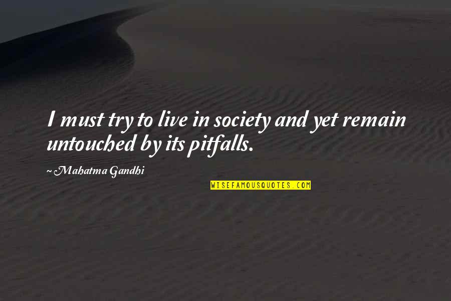Unheroic Death Quotes By Mahatma Gandhi: I must try to live in society and