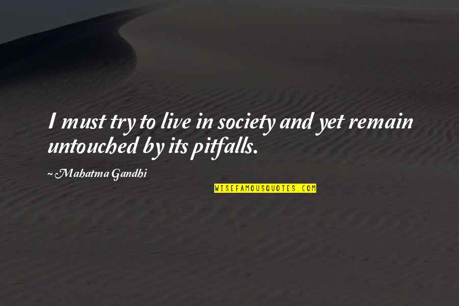 Untouched Quotes By Mahatma Gandhi: I must try to live in society and