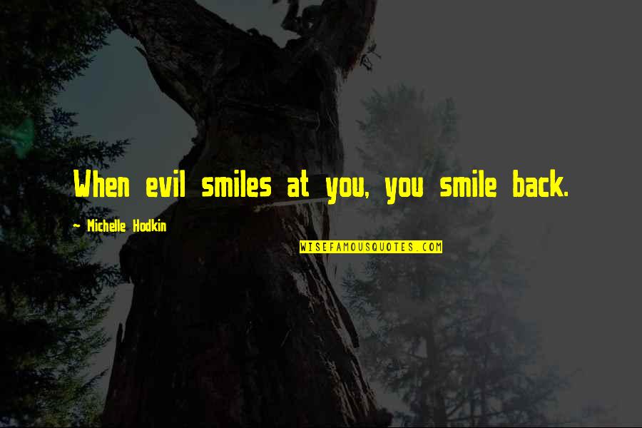 When You Smile Quotes By Michelle Hodkin: When evil smiles at you, you smile back.