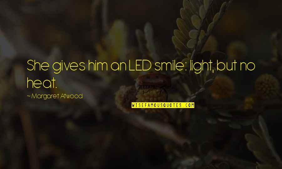 Writing Excellence Quotes By Margaret Atwood: She gives him an LED smile: light, but