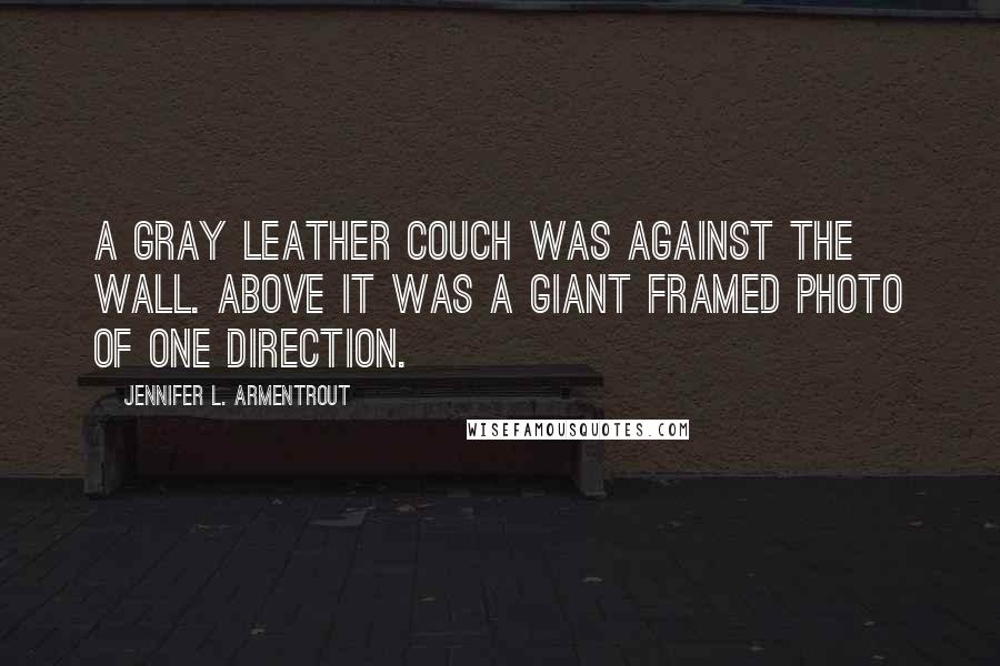 Jennifer L. Armentrout Quotes: A gray leather couch was against the wall. Above it was a giant framed photo of One Direction.