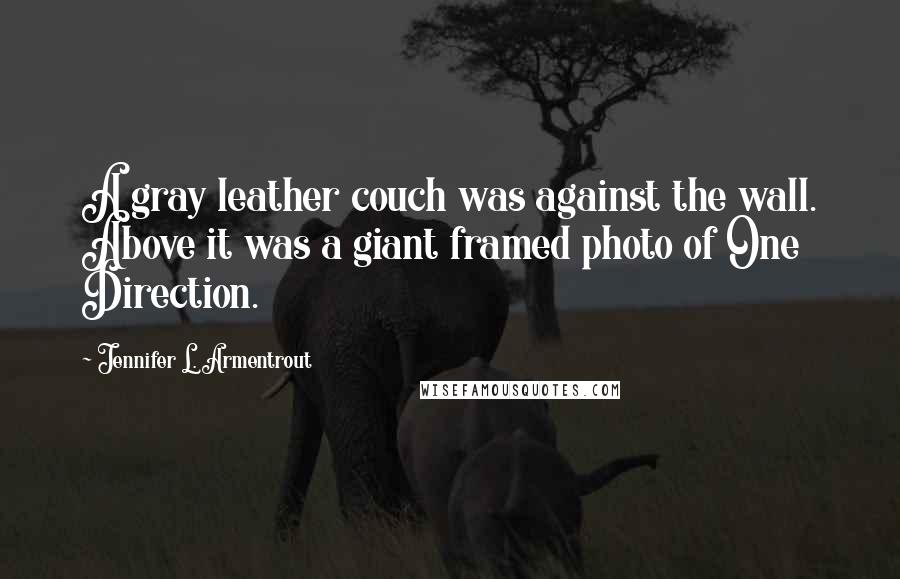 Jennifer L. Armentrout Quotes: A gray leather couch was against the wall. Above it was a giant framed photo of One Direction.