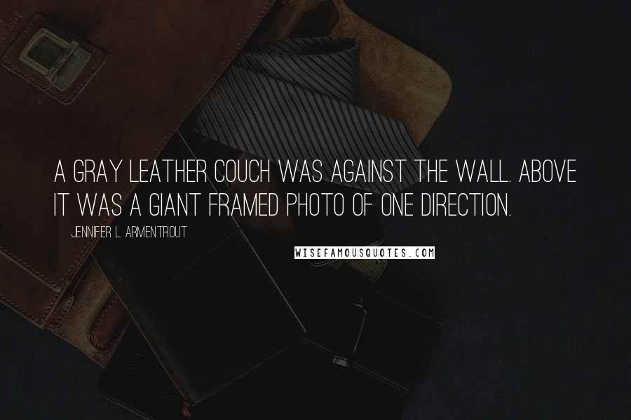 Jennifer L. Armentrout Quotes: A gray leather couch was against the wall. Above it was a giant framed photo of One Direction.