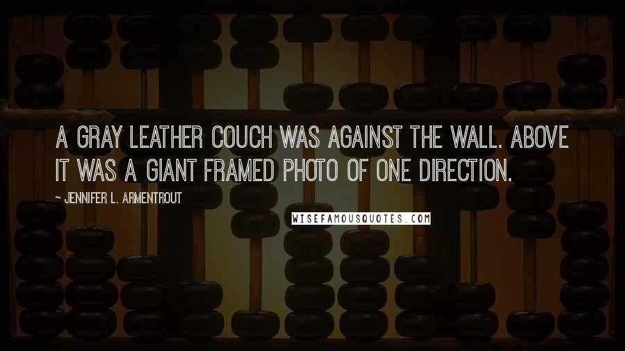 Jennifer L. Armentrout Quotes: A gray leather couch was against the wall. Above it was a giant framed photo of One Direction.