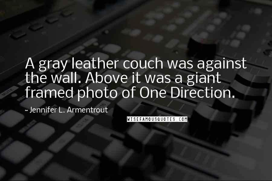 Jennifer L. Armentrout Quotes: A gray leather couch was against the wall. Above it was a giant framed photo of One Direction.