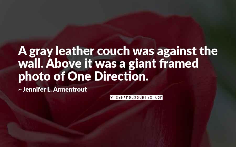 Jennifer L. Armentrout Quotes: A gray leather couch was against the wall. Above it was a giant framed photo of One Direction.