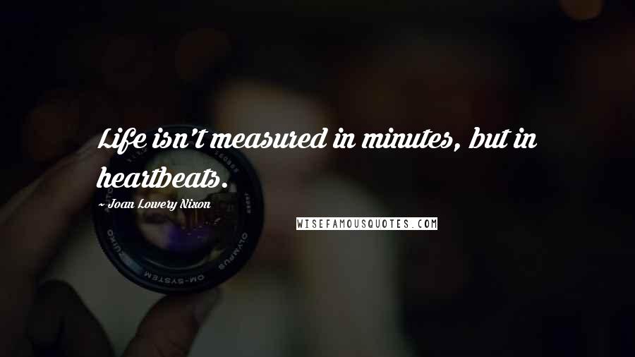 Joan Lowery Nixon Quotes: Life isn't measured in minutes, but in heartbeats.