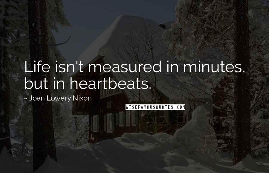 Joan Lowery Nixon Quotes: Life isn't measured in minutes, but in heartbeats.