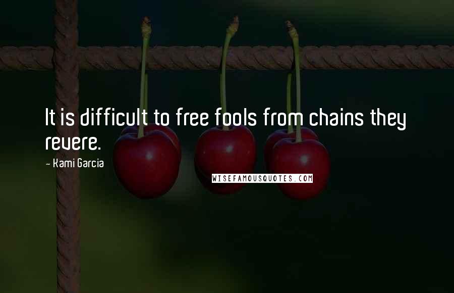 Kami Garcia Quotes: It is difficult to free fools from chains they revere.