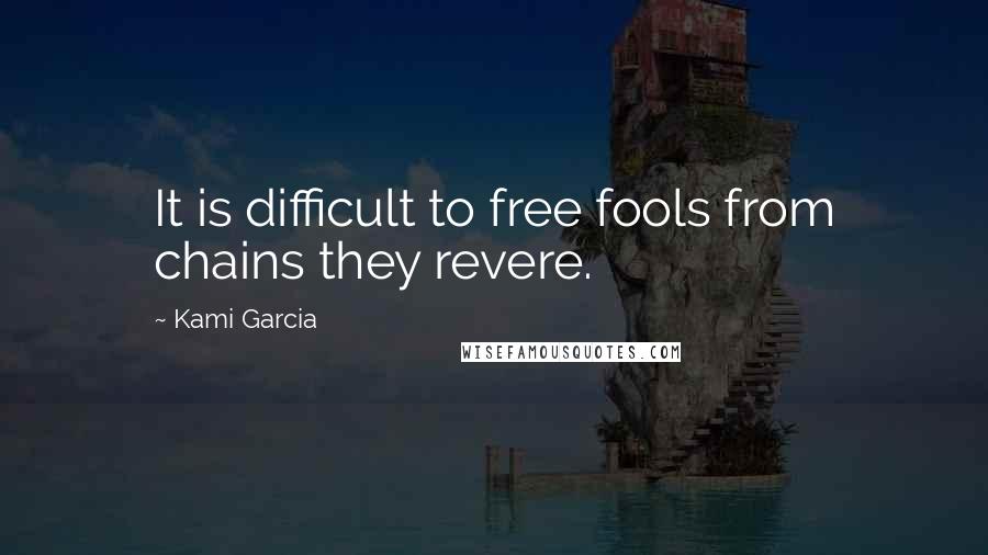 Kami Garcia Quotes: It is difficult to free fools from chains they revere.