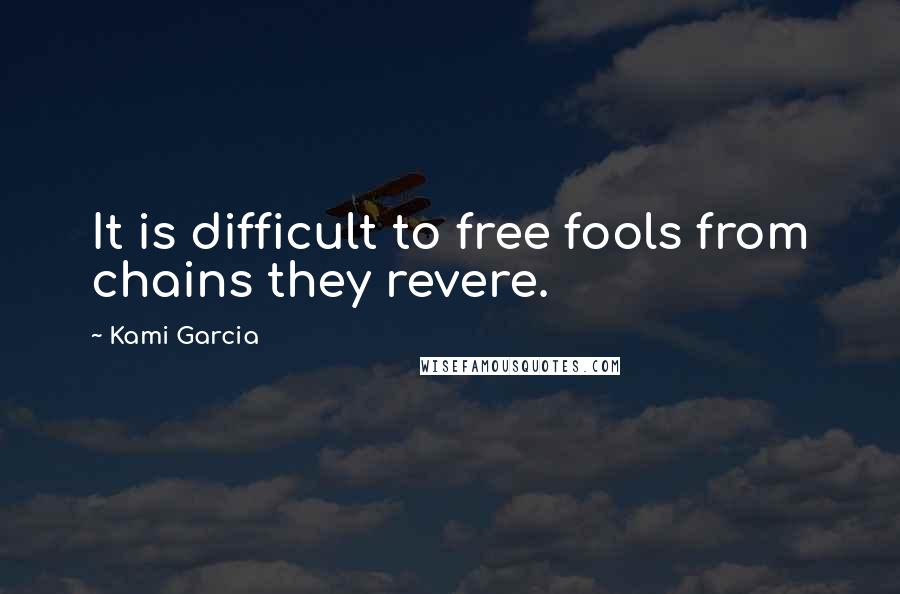 Kami Garcia Quotes: It is difficult to free fools from chains they revere.