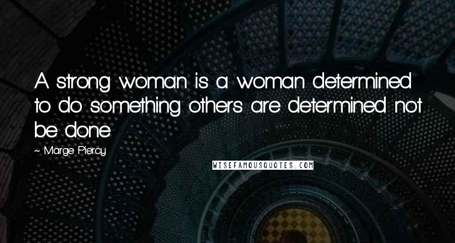 Marge Piercy Quotes: A strong woman is a woman determined to do something others are determined not be done