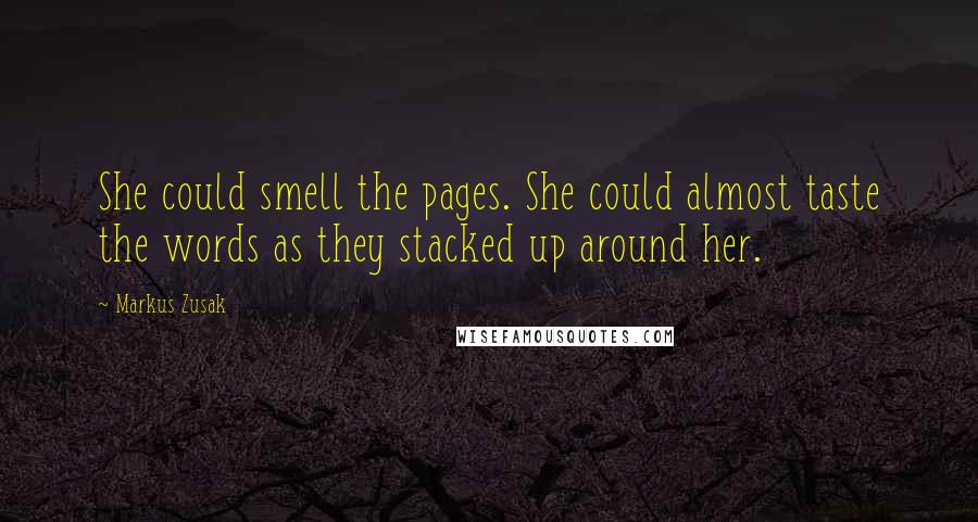 Markus Zusak Quotes: She could smell the pages. She could almost taste the words as they stacked up around her.
