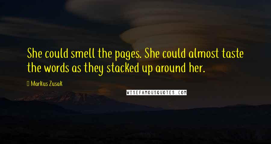 Markus Zusak Quotes: She could smell the pages. She could almost taste the words as they stacked up around her.