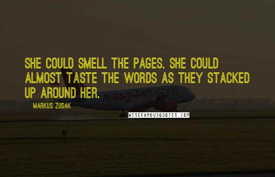 Markus Zusak Quotes: She could smell the pages. She could almost taste the words as they stacked up around her.