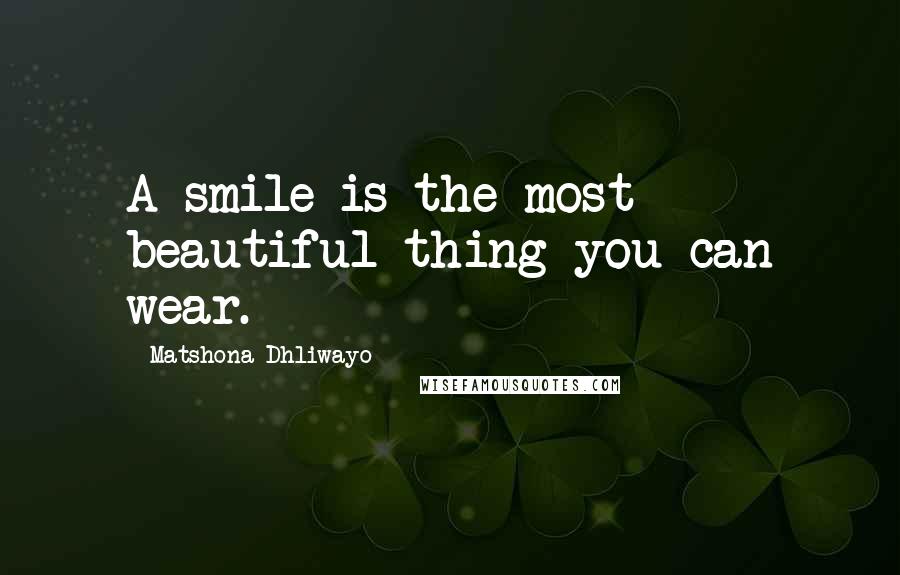 Matshona Dhliwayo Quotes: A smile is the most beautiful thing you can wear.