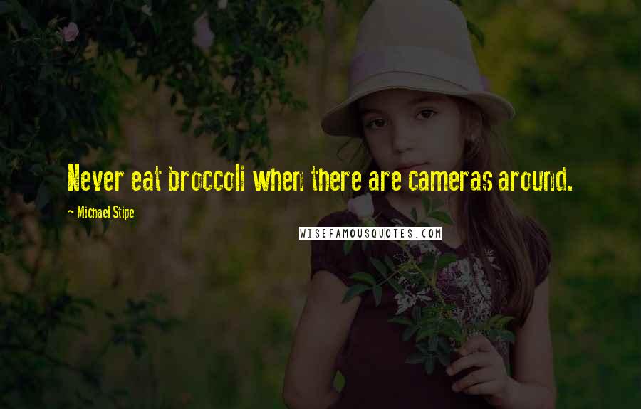 Michael Stipe Quotes: Never eat broccoli when there are cameras around.
