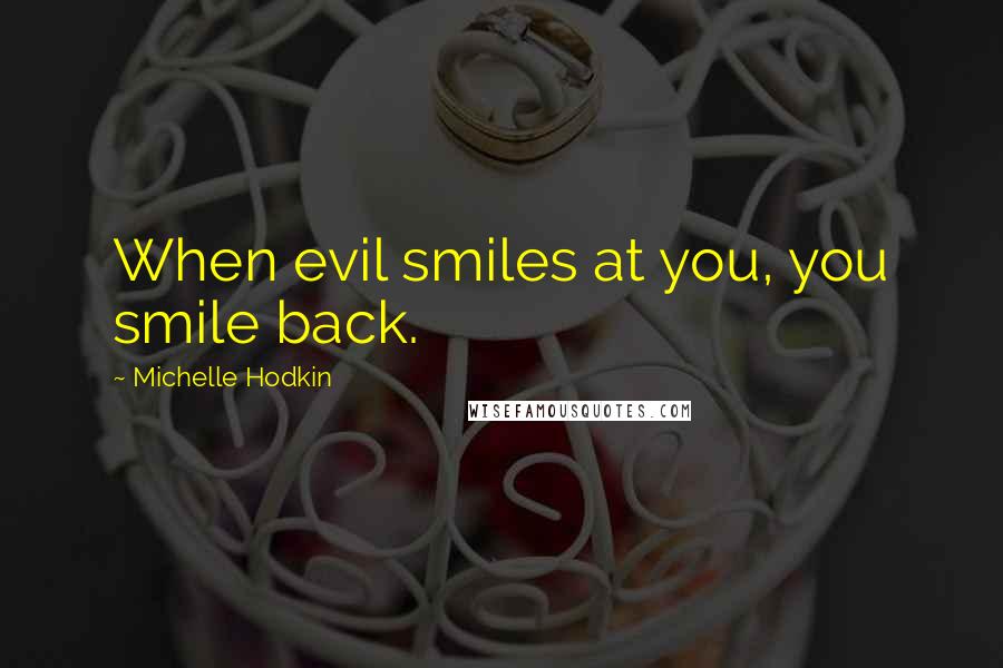 Michelle Hodkin Quotes: When evil smiles at you, you smile back.