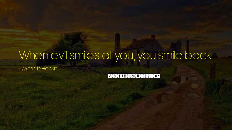 Michelle Hodkin Quotes: When evil smiles at you, you smile back.