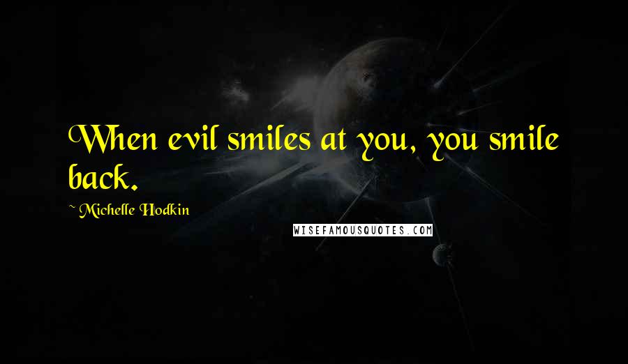 Michelle Hodkin Quotes: When evil smiles at you, you smile back.