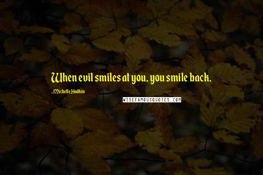 Michelle Hodkin Quotes: When evil smiles at you, you smile back.