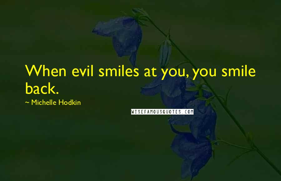 Michelle Hodkin Quotes: When evil smiles at you, you smile back.