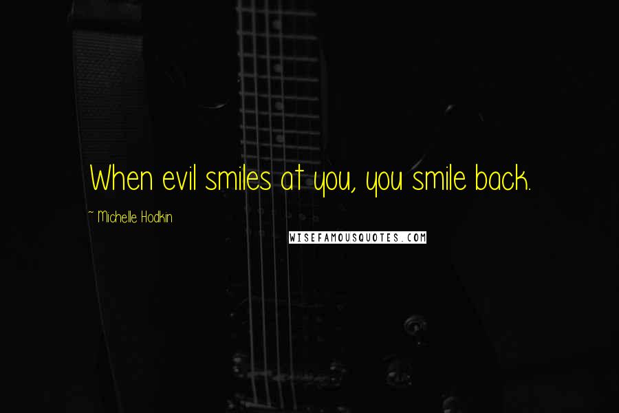 Michelle Hodkin Quotes: When evil smiles at you, you smile back.