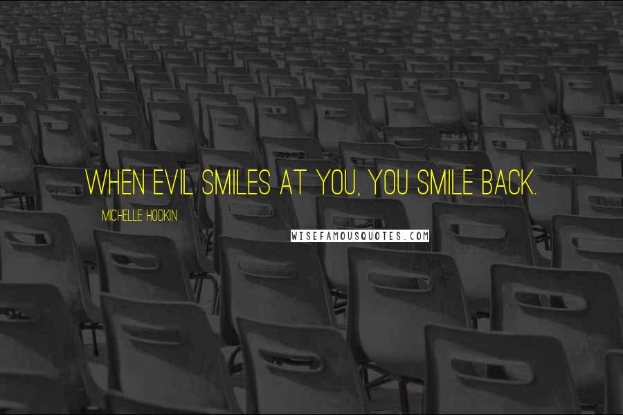 Michelle Hodkin Quotes: When evil smiles at you, you smile back.