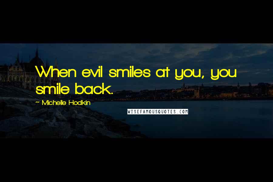 Michelle Hodkin Quotes: When evil smiles at you, you smile back.