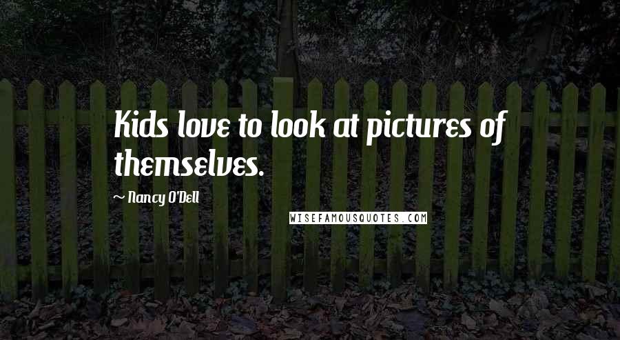 Nancy O'Dell Quotes: Kids love to look at pictures of themselves.