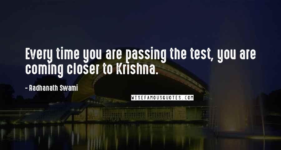 Radhanath Swami Quotes: Every time you are passing the test, you are coming closer to Krishna.