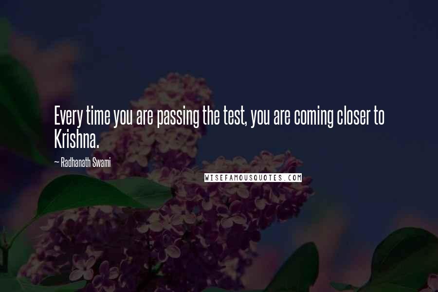 Radhanath Swami Quotes: Every time you are passing the test, you are coming closer to Krishna.