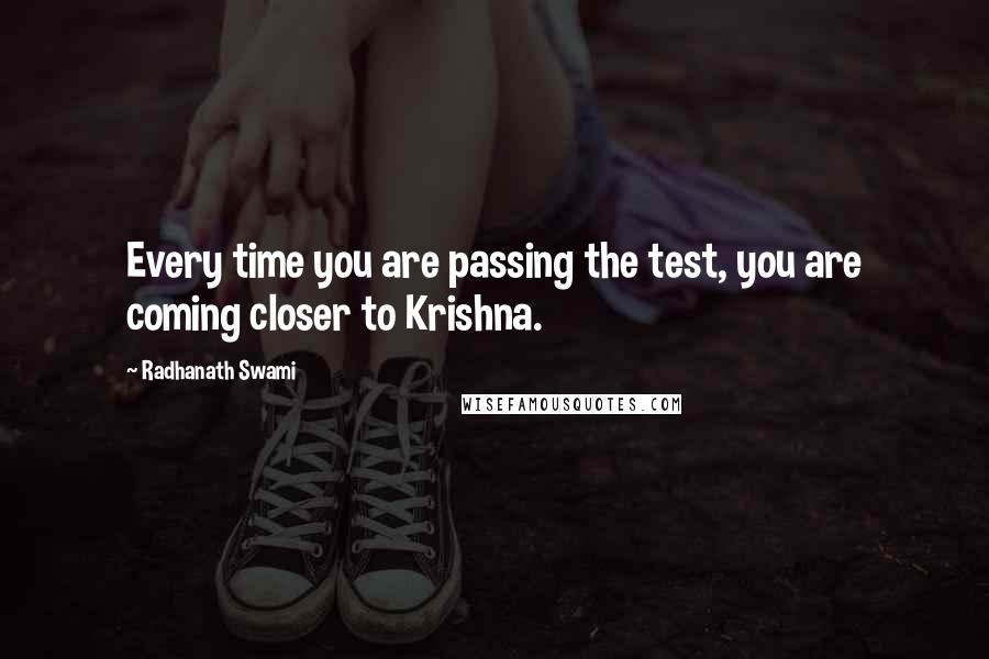 Radhanath Swami Quotes: Every time you are passing the test, you are coming closer to Krishna.