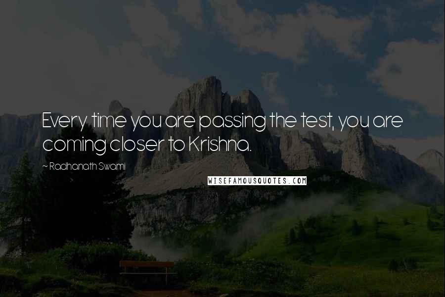 Radhanath Swami Quotes: Every time you are passing the test, you are coming closer to Krishna.