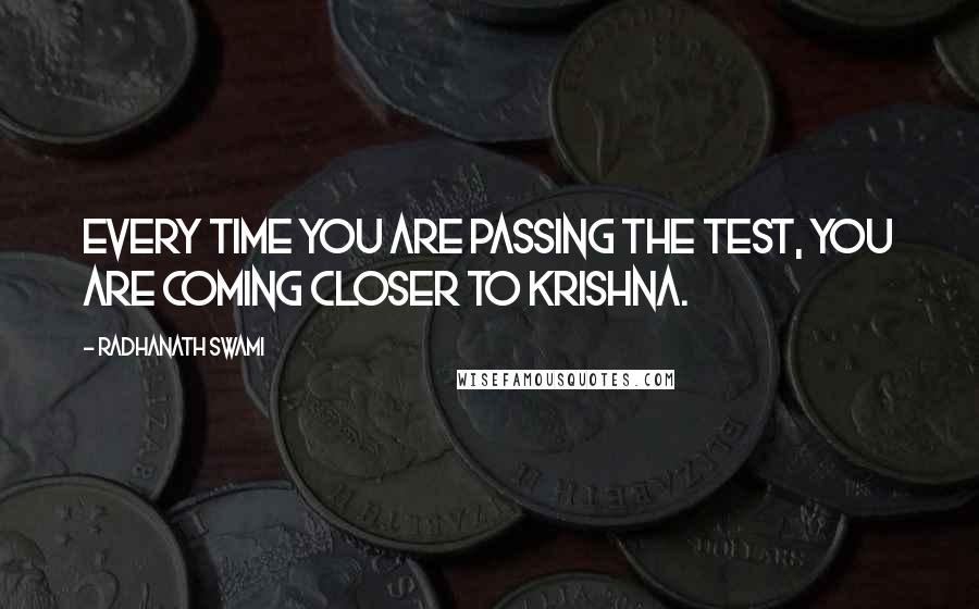 Radhanath Swami Quotes: Every time you are passing the test, you are coming closer to Krishna.