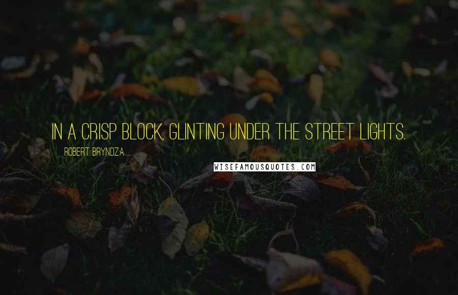 Robert Bryndza Quotes: in a crisp block, glinting under the street lights.