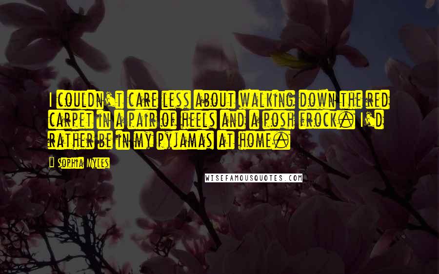 Sophia Myles Quotes: I couldn't care less about walking down the red carpet in a pair of heels and a posh frock. I'd rather be in my pyjamas at home.