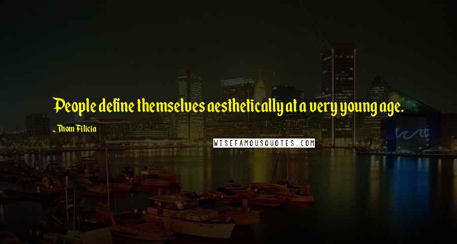 Thom Filicia Quotes: People define themselves aesthetically at a very young age.