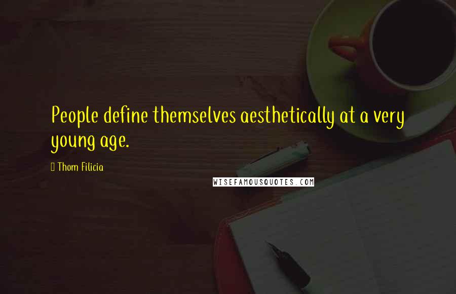 Thom Filicia Quotes: People define themselves aesthetically at a very young age.