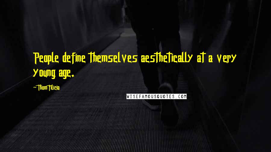 Thom Filicia Quotes: People define themselves aesthetically at a very young age.