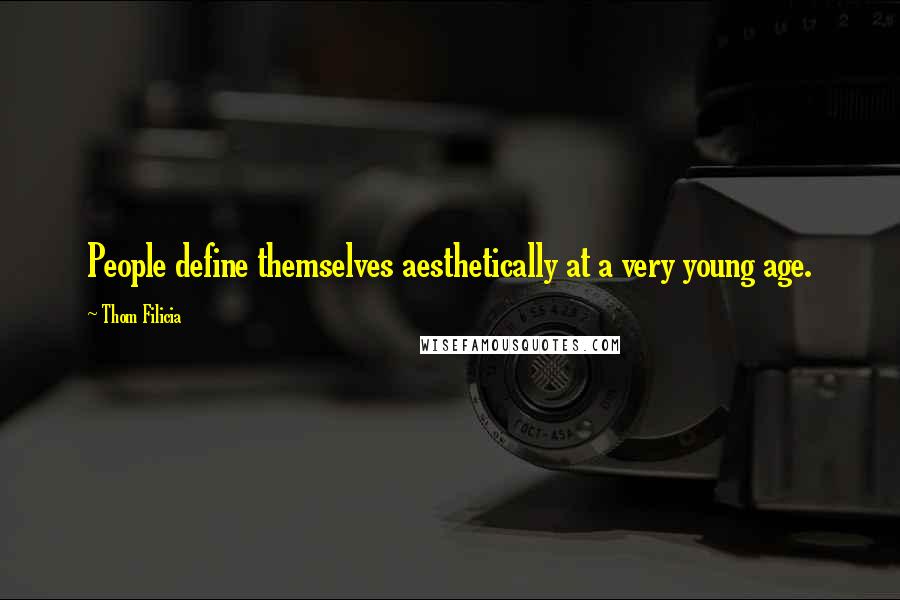 Thom Filicia Quotes: People define themselves aesthetically at a very young age.