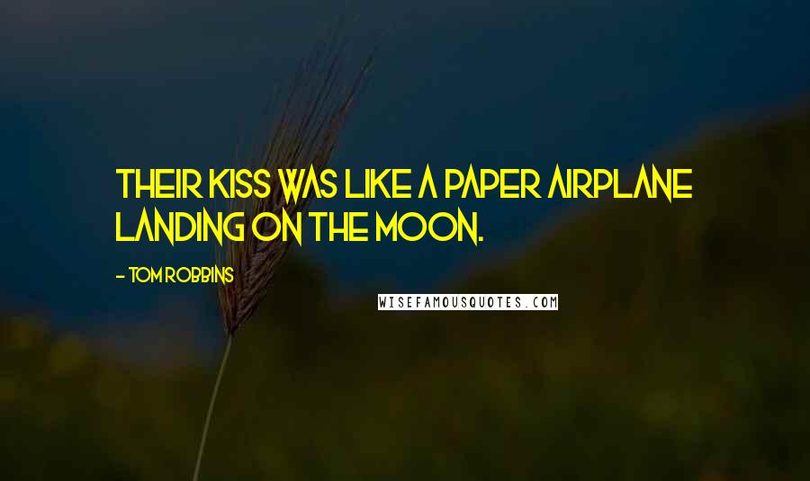 Tom Robbins Quotes: Their kiss was like a paper airplane landing on the moon.