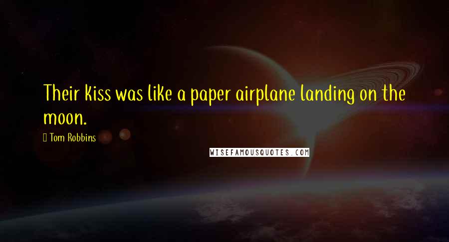 Tom Robbins Quotes: Their kiss was like a paper airplane landing on the moon.